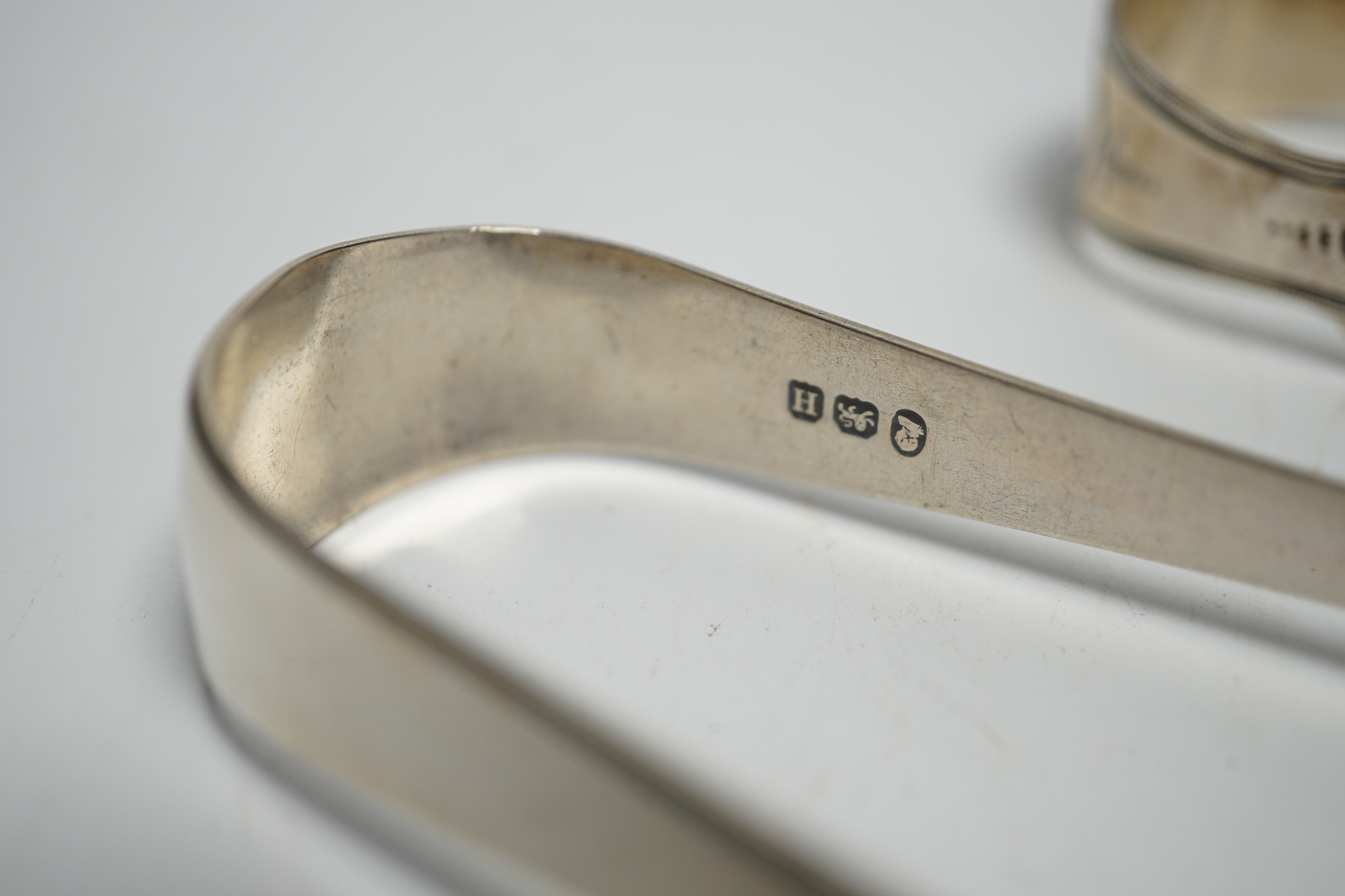 Eight assorted pairs of 18th and 19th century silver sugar tongs including Peter & Ann Bateman.